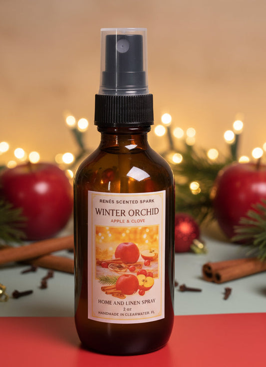 Brown spray bottle labeled 'Winter Orchid' with festive background