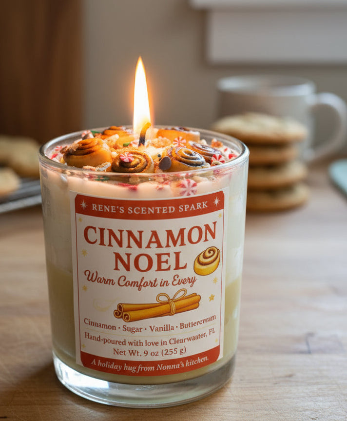 Cinnamon Noel candle with cinnamon roll decorations and festive label, hand-poured by René’s Scented Spark in Clearwater, FL.