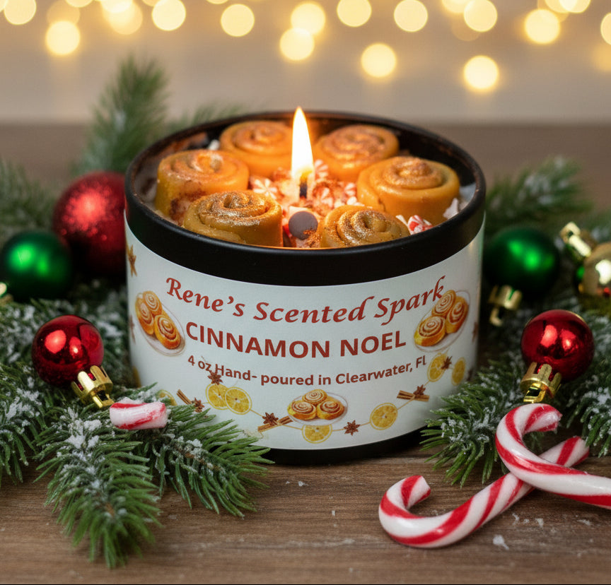 4 oz Cinnamon Noel candle tin topped with mini cinnamon roll wax embeds and sprinkles, hand-poured by Rene’s Scented Spark in Clearwater, FL.