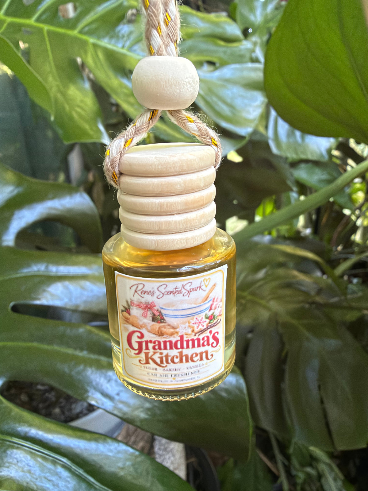 Grandma's Kitchen hanging glass car diffuser with wooden cap, hand-filled by Rene's Scented Spark in Clearwater, FL