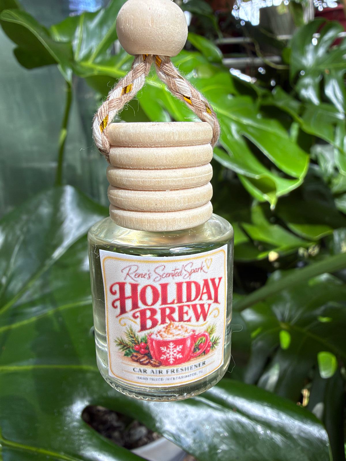 Holiday Brew hanging glass car diffuser with wooden cap, hand-filled by Rene's Scented Spark in Clearwater, FL