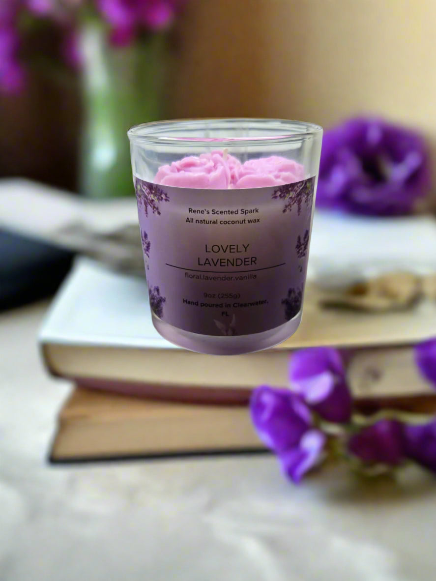 Lovely Lavender candle glowing on a table beside books and flowers, creating a spa-like, calming atmosphere — perfect for self-care or gifting