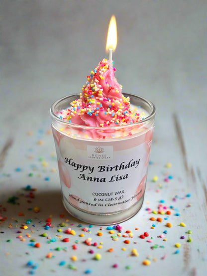 Happy Birthday candle made with coconut wax, topped with pink swirl and colorful sprinkles.