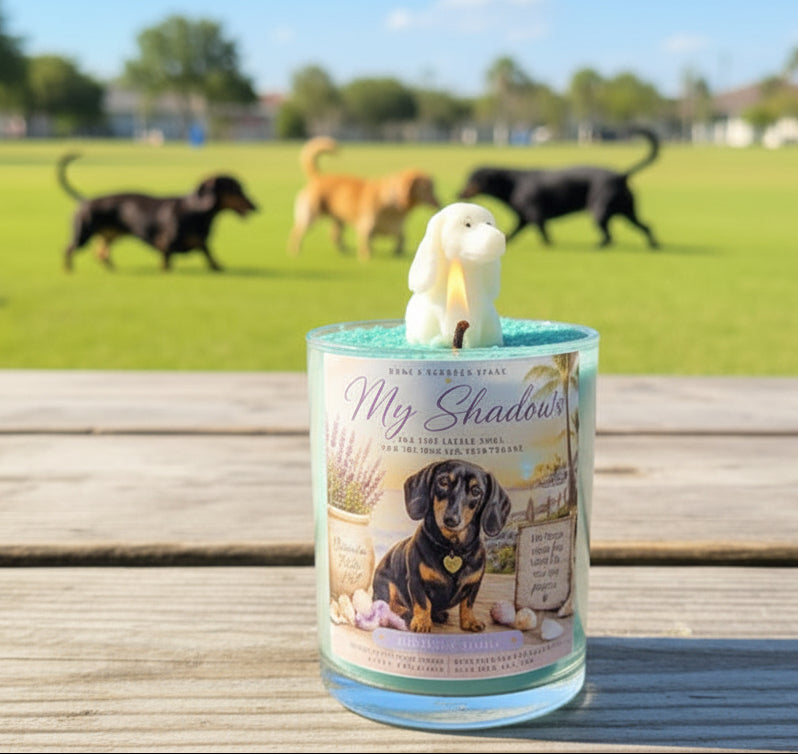 Candle with a dog figurine on top, featuring a dog illustration and text, set against a background of dogs playing in a park.