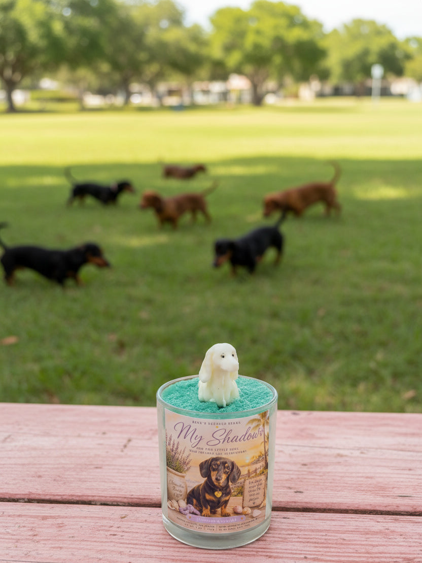 Candle with a dog figurine on a table in a park setting