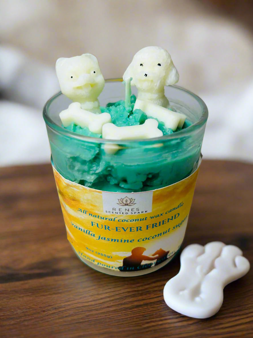 Fur-Ever Friend candle with teal coconut wax topped with two white dog-shaped molds and bone embeds, infused with warm vanilla — gift for dog lovers