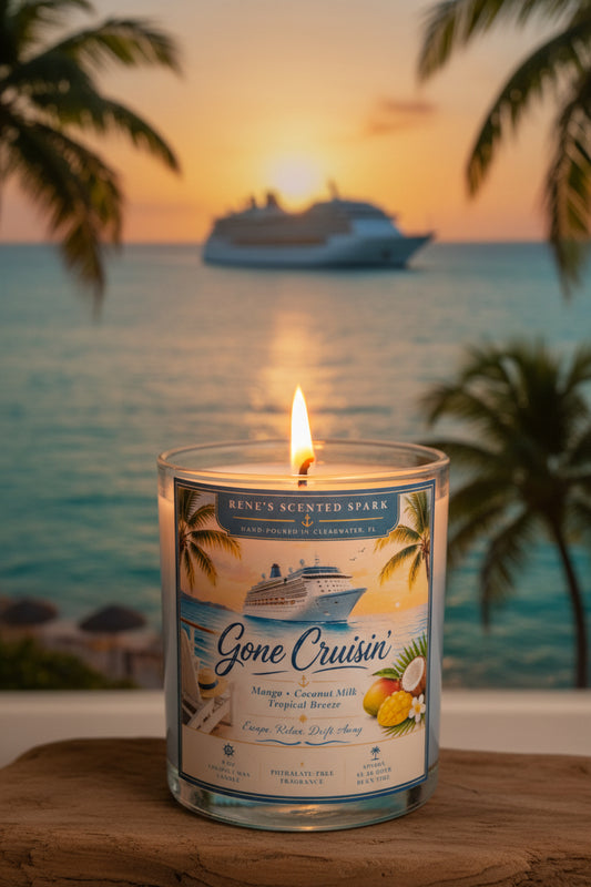 Candle labeled 'Gone Cruisin'' with a cruise ship and sunset in the background.