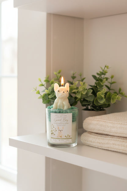  Good Boy candle with cream Frenchie wax topper on teal green whipped wax with white flowers in lifestyle setting
