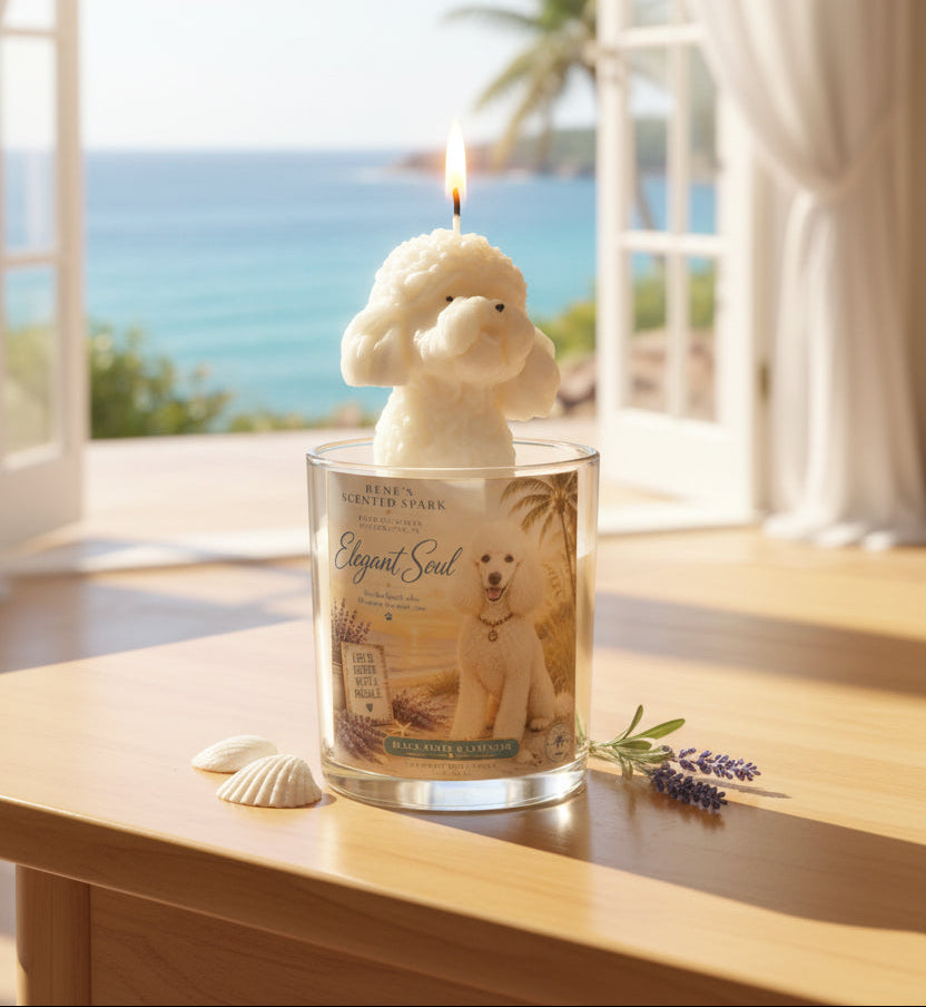 Hand-poured coconut wax poodle candle with a sculpted white poodle wax topper and Elegant Soul label, displayed on a wooden table with seashells and lavender, overlooking a bright ocean view through open windows.