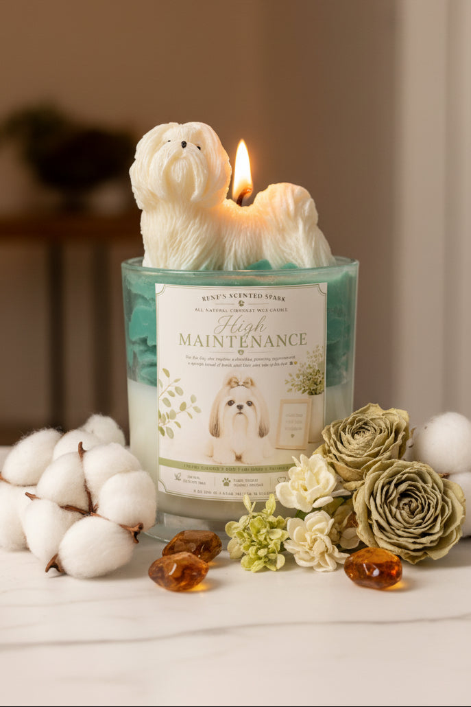 High Maintenance candle with white Shih Tzu wax topper on teal green wax on white vanity with pink roses