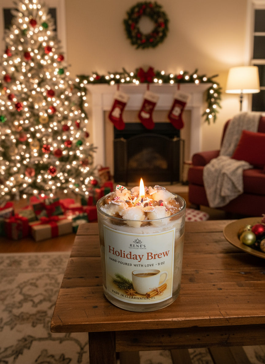 Candle labeled 'Holiday Brew' on a wooden table with a decorated Christmas tree and fireplace in the background.