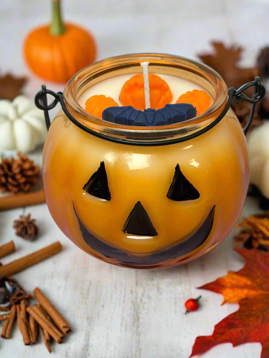 Jack’s Spiced Lantern candle in a jack-o’-lantern jar with coconut wax, pumpkin and spice fragrance — festive fall décor and Halloween gift