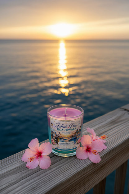 Candle with a scenic sunset over water background