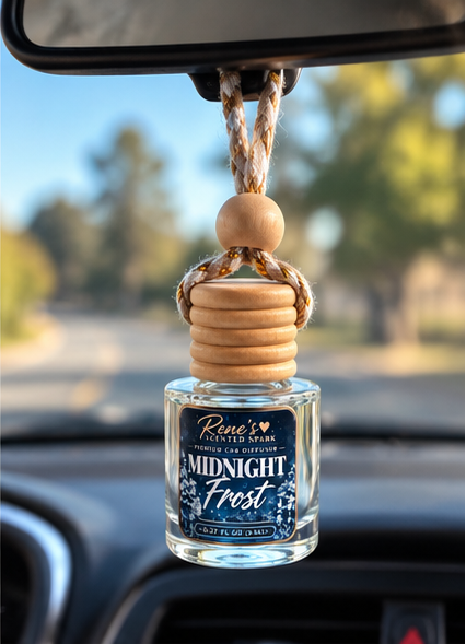 Midnight Frost hanging car freshener by Rene’s Scented Spark displayed from a rearview mirror inside a car