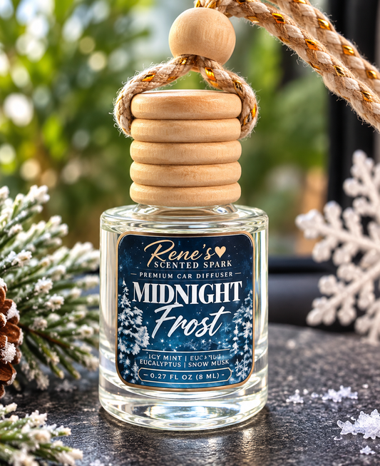 Midnight Frost hanging car freshener by Rene’s Scented Spark displayed with frosted pine branches, pinecones, and icy winter accents.