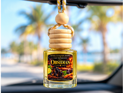 Obsidian hanging car fragrance diffuser with wooden cap and cord, styled with lime slices, spices and rocks