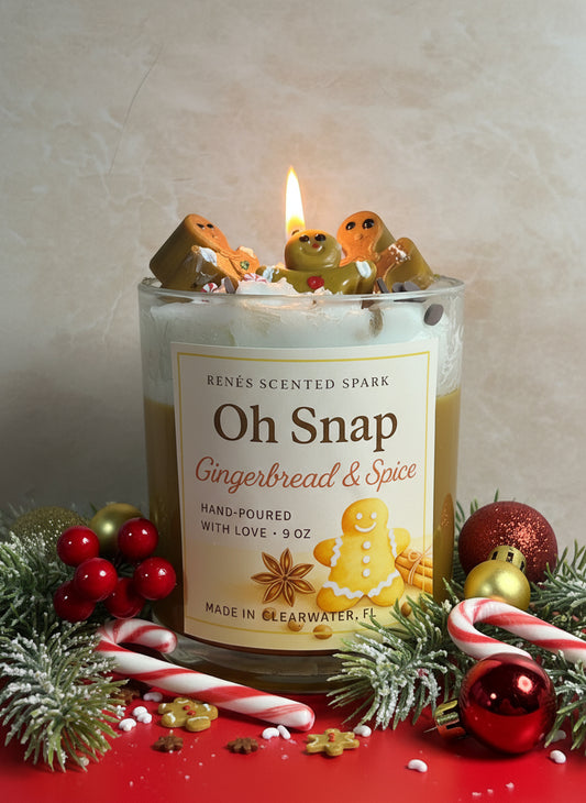 Candle labeled 'Oh Snap Gingerbread & Spice' with gingerbread men decorations on a festive background.
