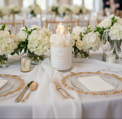 Wedding candle with bride and groom topper displayed on ornate gold tray with white flowers and elegant table décor