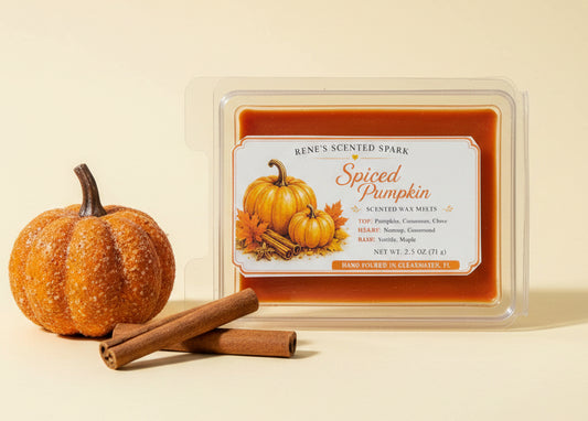 Spiced Pumpkin 2.5 oz scented wax melts displayed with an orange pumpkin and cinnamon sticks on a warm cream background.