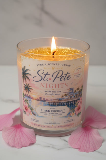 Candle labeled 'St. Pete Nights' with decorative design on a light blue background