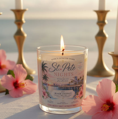 Candle labeled 'St. Pete Nights' with decorative design on a light blue background