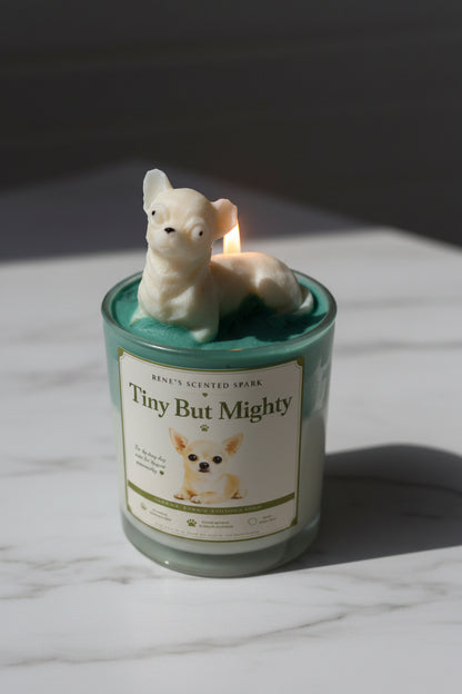 Tiny But Mighty candle with cream Chihuahua wax topper on teal green wax on white marble in natural window light