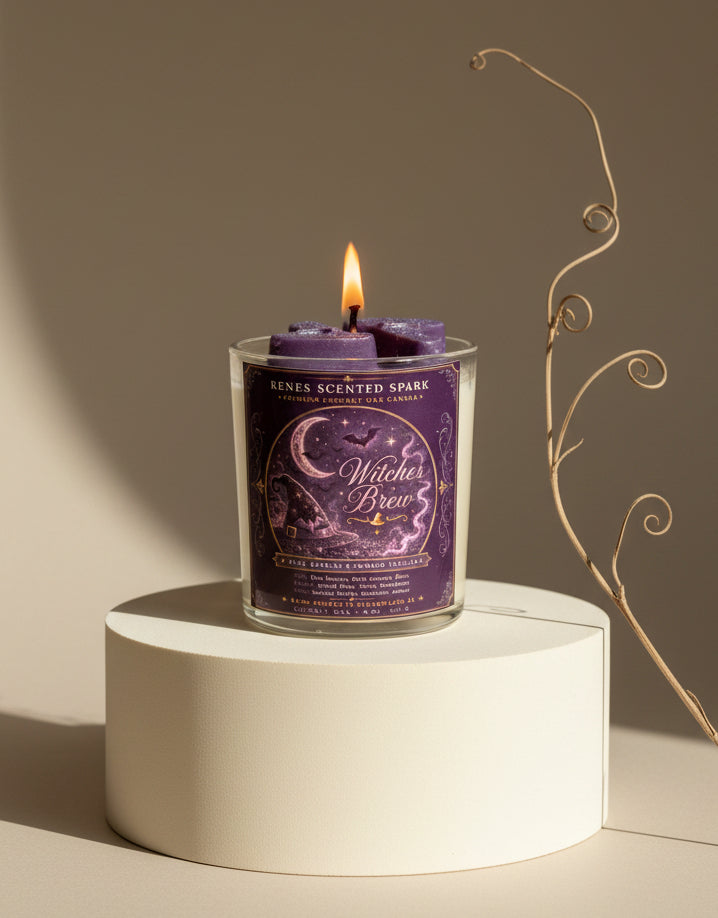 Witches Brew Halloween coconut wax candle burning on a cream pedestal in warm natural light with purple witch hat wax toppers and minimalist fall styling.