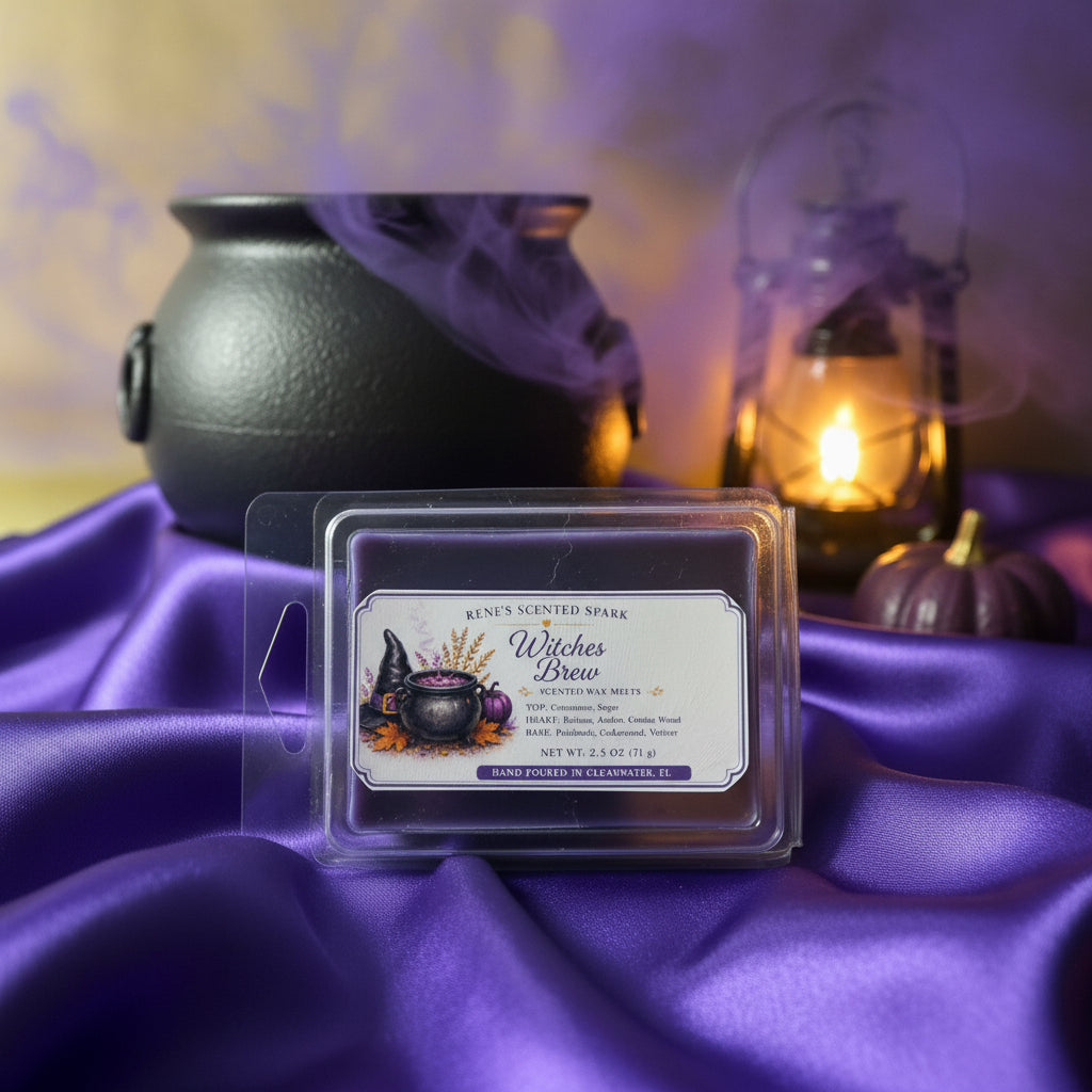 Witches Brew purple wax melts by Rene’s Scented Spark displayed on rich purple satin with a black cauldron, glowing lantern, purple pumpkin, and mystical smoke.