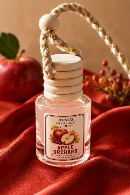 Apple Orchard hanging car freshener by Renes Scented Spark styled with a fresh red apple, autumn berries and warm red fabric.