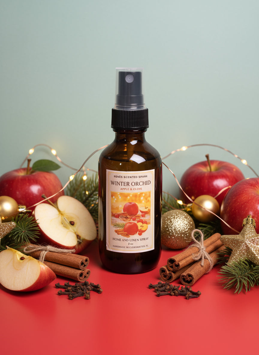 Bottle of Winter Orchid home and linen spray on a red surface with a gray background