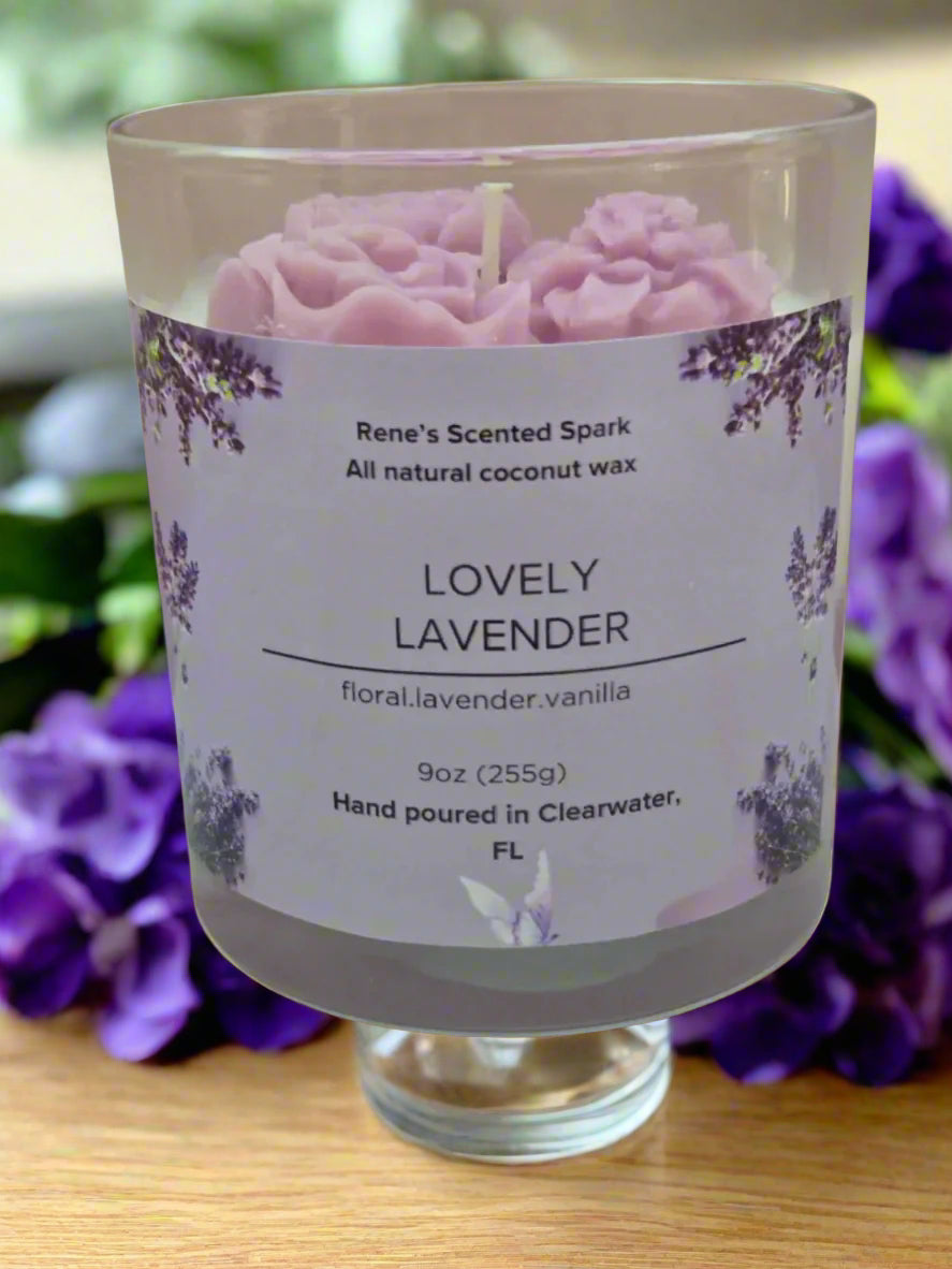 Lovely Lavender candle glowing on a table beside books and flowers, creating a spa-like, calming atmosphere — perfect for self-care or gifting