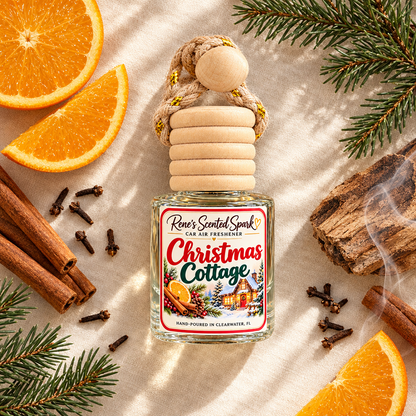 Christmas Cottage car freshener in a knit Christmas stocking with pine sprigs, cinnamon and gold ornaments