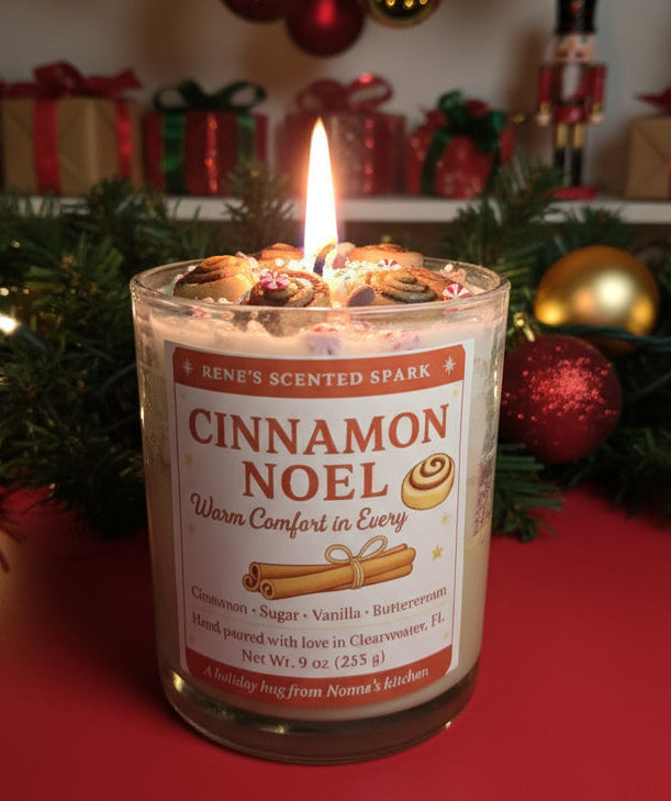 Cinnamon Noel candle with cinnamon roll decorations and festive  label, hand-poured by René’s Scented Spark in Clearwater, FL.