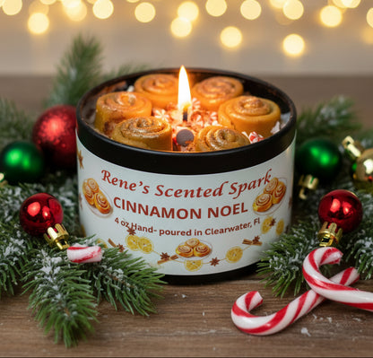 4 oz Cinnamon Noel candle tin topped with mini cinnamon roll wax embeds and sprinkles, hand-poured by Rene’s Scented Spark in Clearwater, FL.