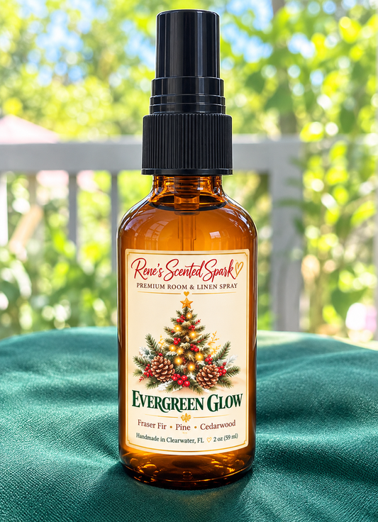 Rene's Scented Spark Evergreen Glow 2 oz room spray in amber glass bottle with Christmas tree label on green velvet outdoors