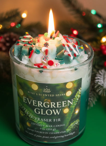 Decorative candle in a glass jar labeled 'Evergreen Glow' with festive background