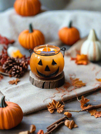 Jack’s Spiced Lantern candle glowing on a cozy autumn table with pumpkins, leaves, and warm décor — pumpkin spice fall candle gift