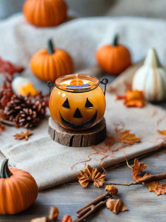 Jack’s Spiced Lantern candle glowing on a cozy autumn table with pumpkins, leaves, and warm décor — pumpkin spice fall candle gift