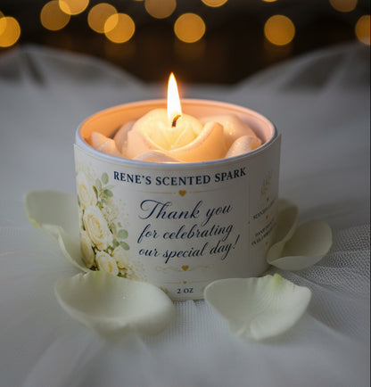4 oz wedding favor candle with sculpted white rose wax topper and thank-you label, glowing among white rose petals and warm wedding lights.
