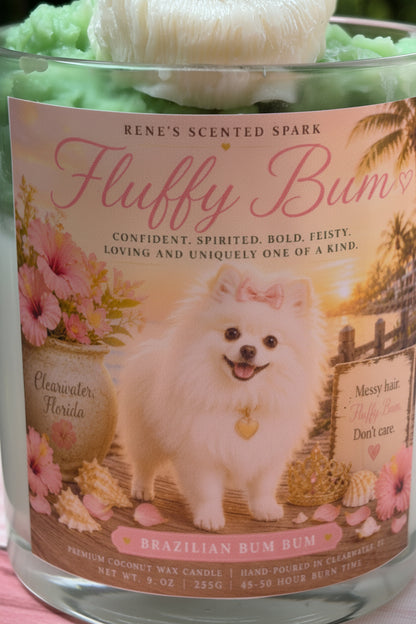 Candle labeled 'Fluffy Bum' with a dog illustration on a pink background