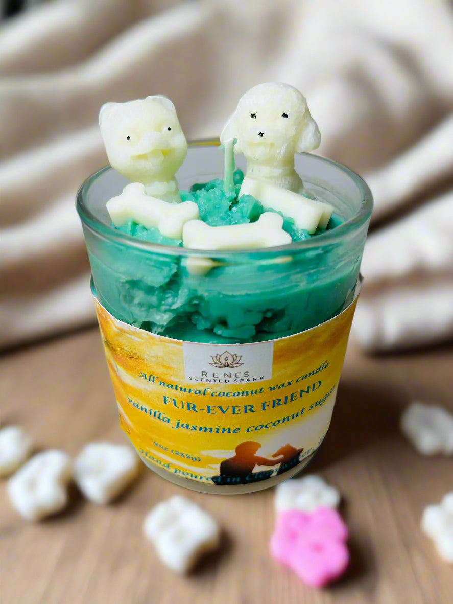 Fur-Ever Friend candle with teal coconut wax topped with two white dog-shaped molds and bone embeds, infused with warm vanilla — gift for dog lovers