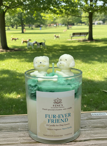 Candle with dog-shaped candle wicks in a jar, labeled 'Fur-Ever Friend', outdoors on a wooden surface with trees and grass in the background.
