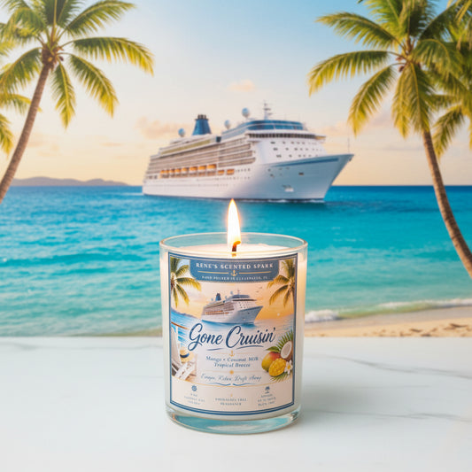 Hand-poured Gone Cruisin' coconut wax candle displayed on a beach with a tropical cruise ship in the background. Features a Mango Coconut Milk fragrance and coastal vacation-inspired label by Rene's Scented Spark.