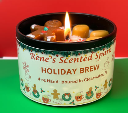4 oz Holiday Brew candle in a black tin with a gingerbread man and peppermint wax toppings, hand-poured by Rene’s Scented Spark in Clearwater, FL.