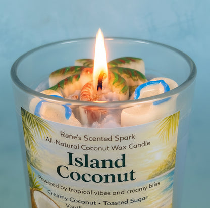 Candle labeled 'Island Coconut' with a label featuring coconut imagery on a light blue background with flip flop molds and a palm tree