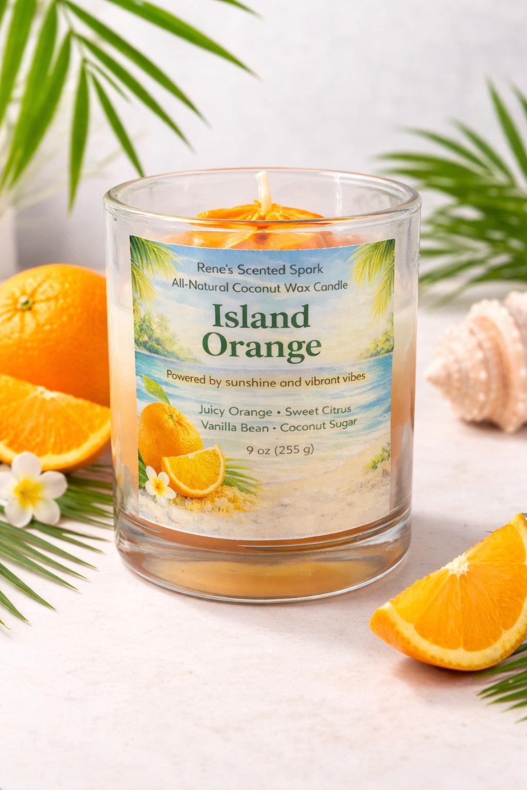 Unlit Island Orange coconut wax candle in a clear glass jar, featuring a tropical beach label with orange slices and citrus scent notes, 9 oz size