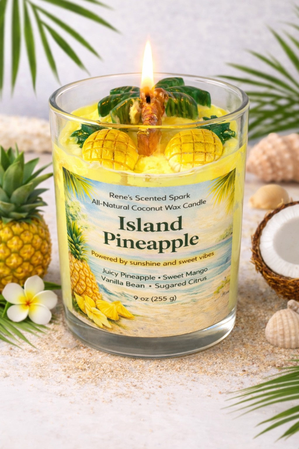 Island Pineapple candle with a label and decorative elements on a sandy background