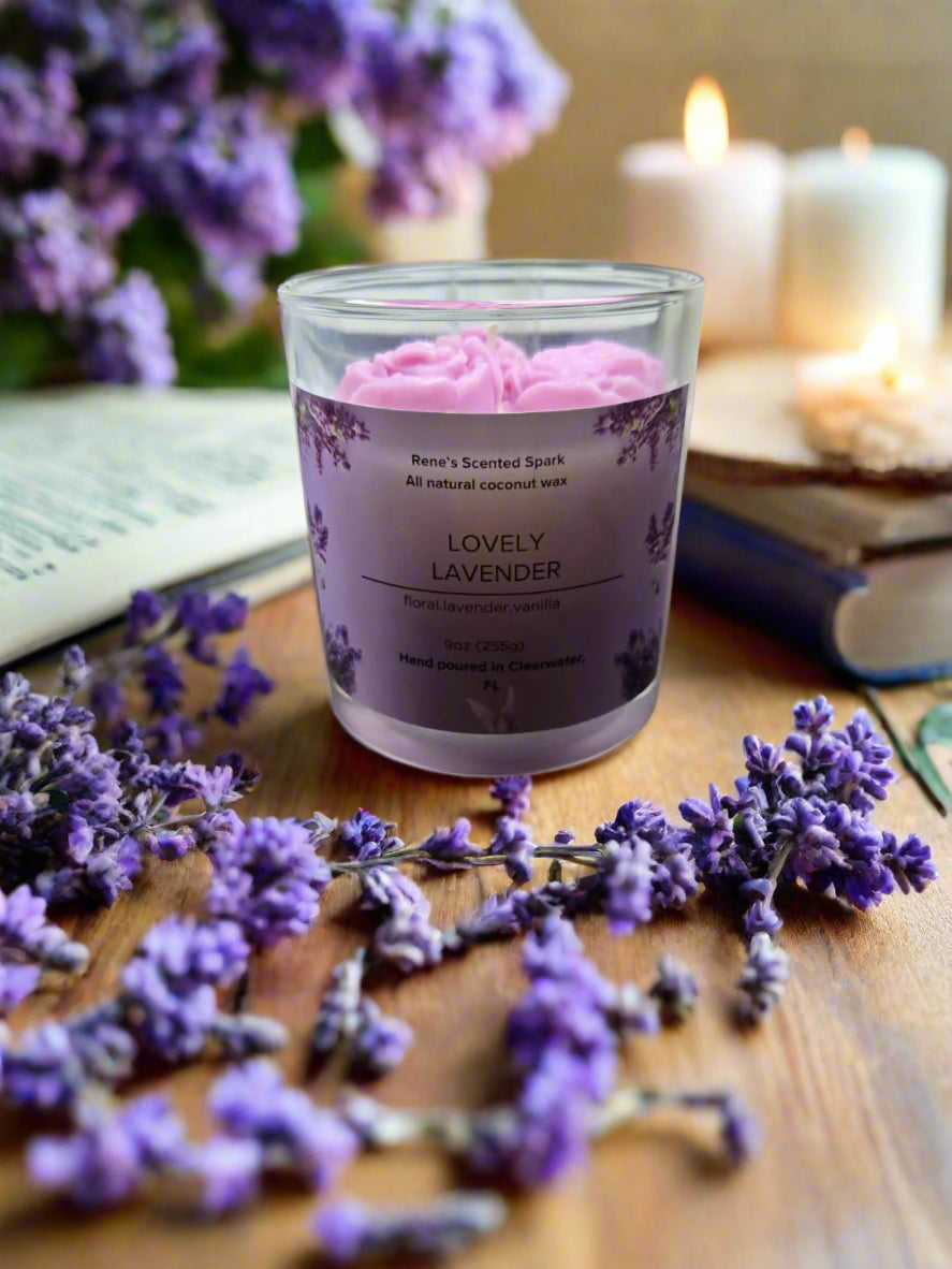 Lovely Lavender candle glowing on a table beside books and flowers, creating a spa-like, calming atmosphere — perfect for self-care or gifting