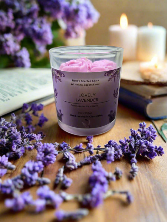 Lovely Lavender candle glowing on a table beside books and flowers, creating a spa-like, calming atmosphere — perfect for self-care or gifting