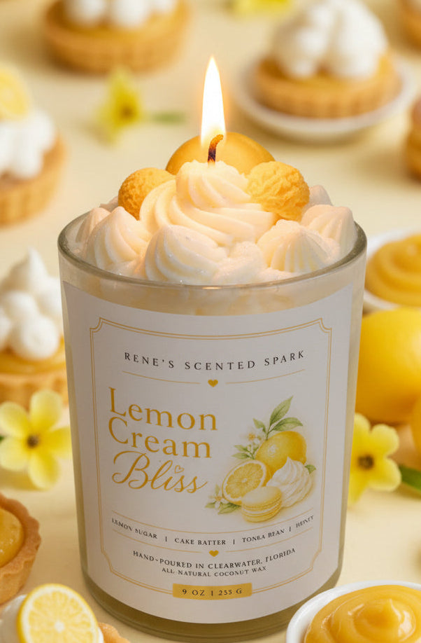 Candle labeled 'Lemon Cream Bliss' with lemon slices on top, surrounded by lemon-themed treats.